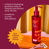Red bottle of Dollar Shave Club shave oil with text on a purple and orange background