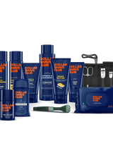 Collection of Dollar Shave Club products including bottles, a pouch, and grooming tools on a black background.